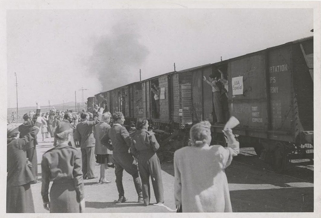 Refugees departing by train for America