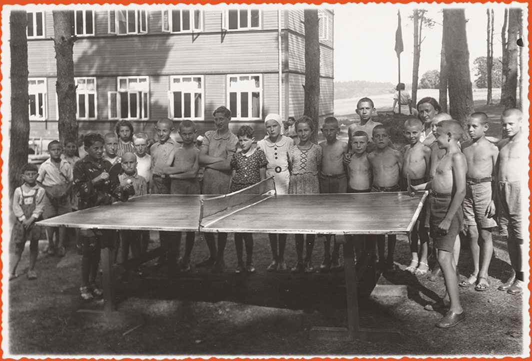 Children playing and watching ping pong game
