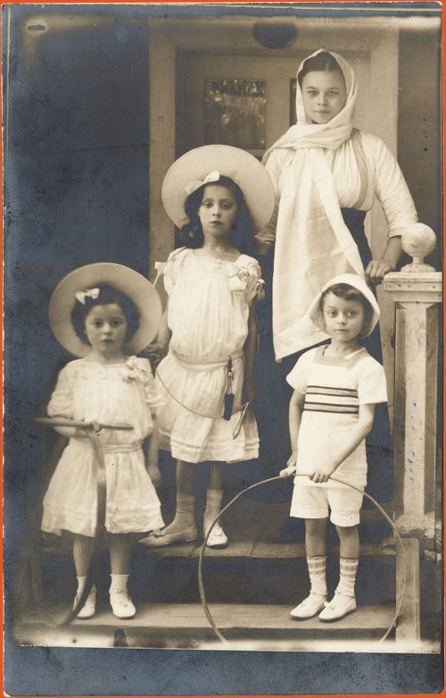 Three children in resort attire