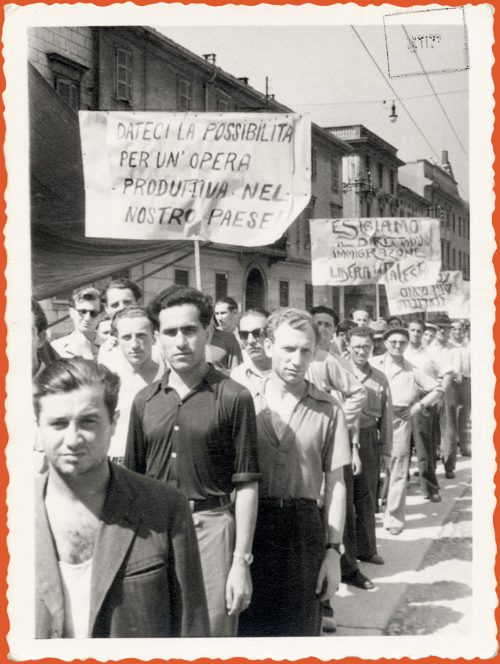 Photograph of demonstrators marching with signs