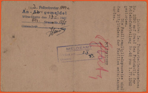 Light pink ID card in German. Back of document. Includes stamps and handwritten notes.