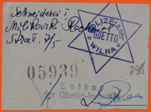 Document handwritten in blue ink on white paper. Stamp of the ghetto police (star of david with the inscription Ghetto Polizei Wilna), stamp with number 05939, and a stamp with a signature.